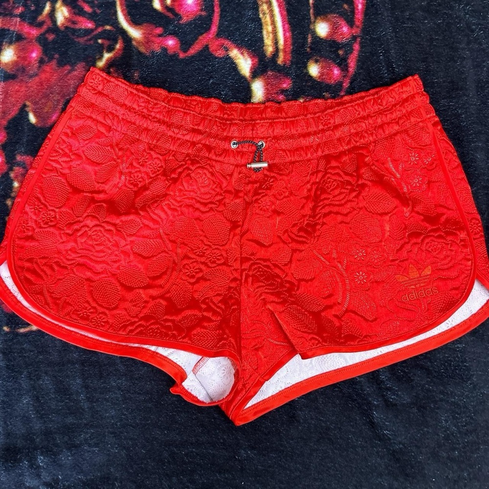 Red quilted pattern adidas shorts
